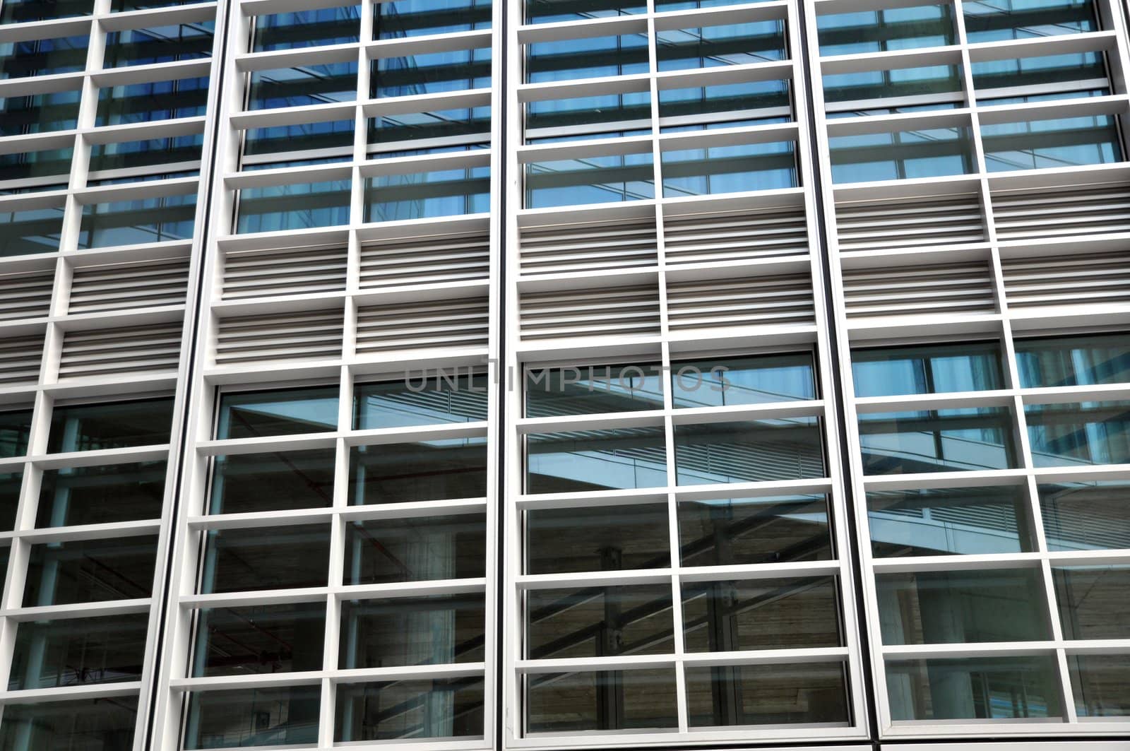 windows of a modern office building facade made of steel and glass