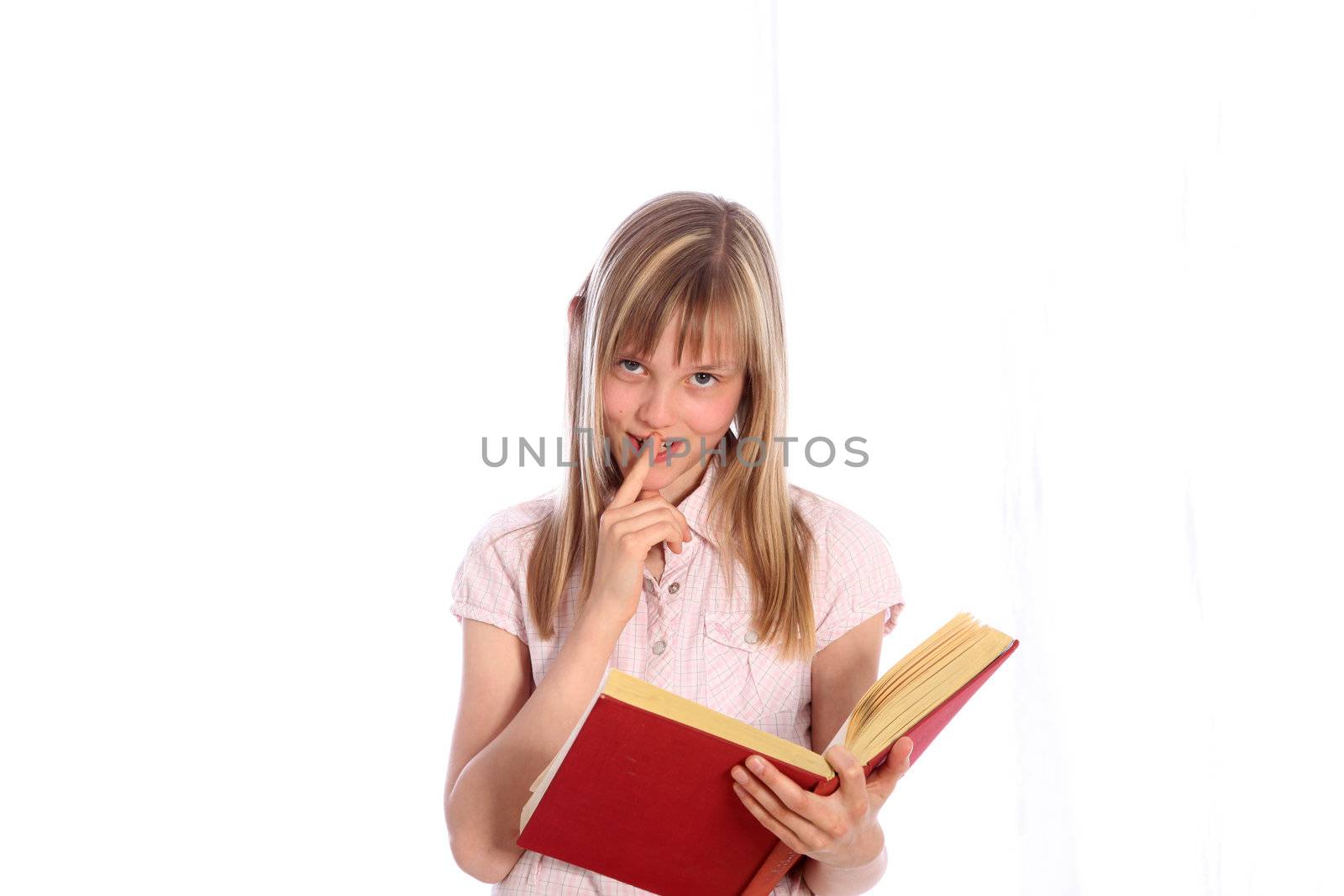 Happy young girl with a red book. It looks towards the camera and smiles - Cut Out