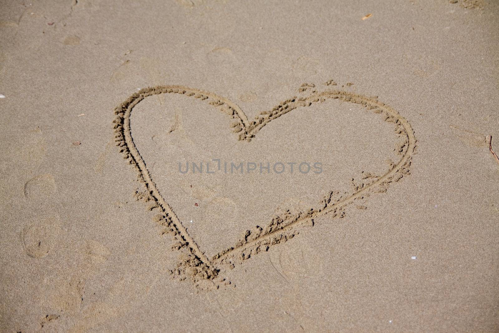 Heart written on the beach to show the love 