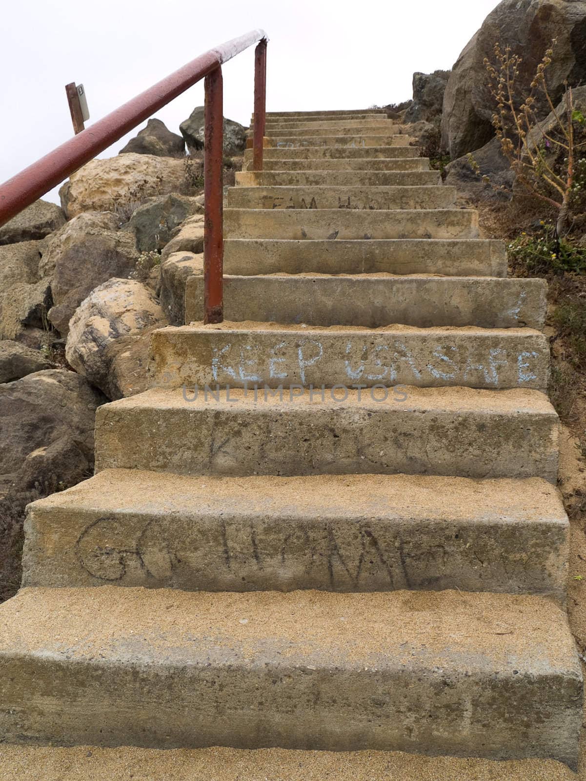 Worn concrete stairs, complete with graffiti.