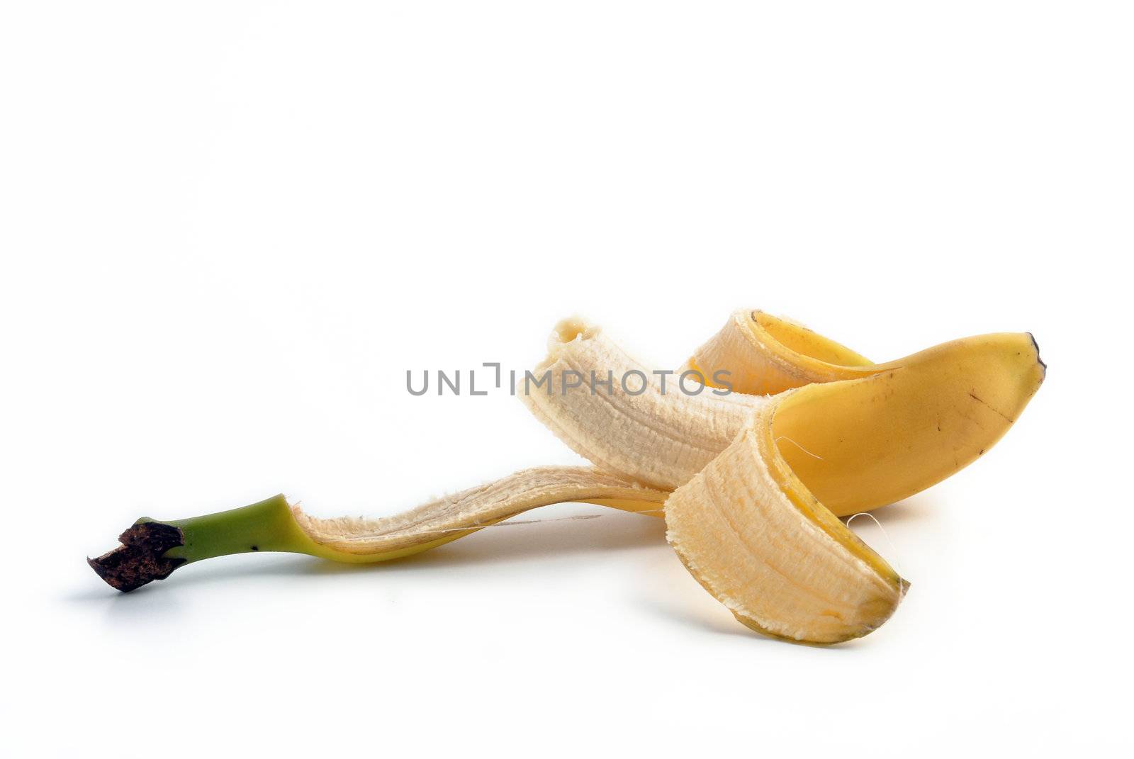 Peeled biteen banana. Isolated fruit over white by cienpies