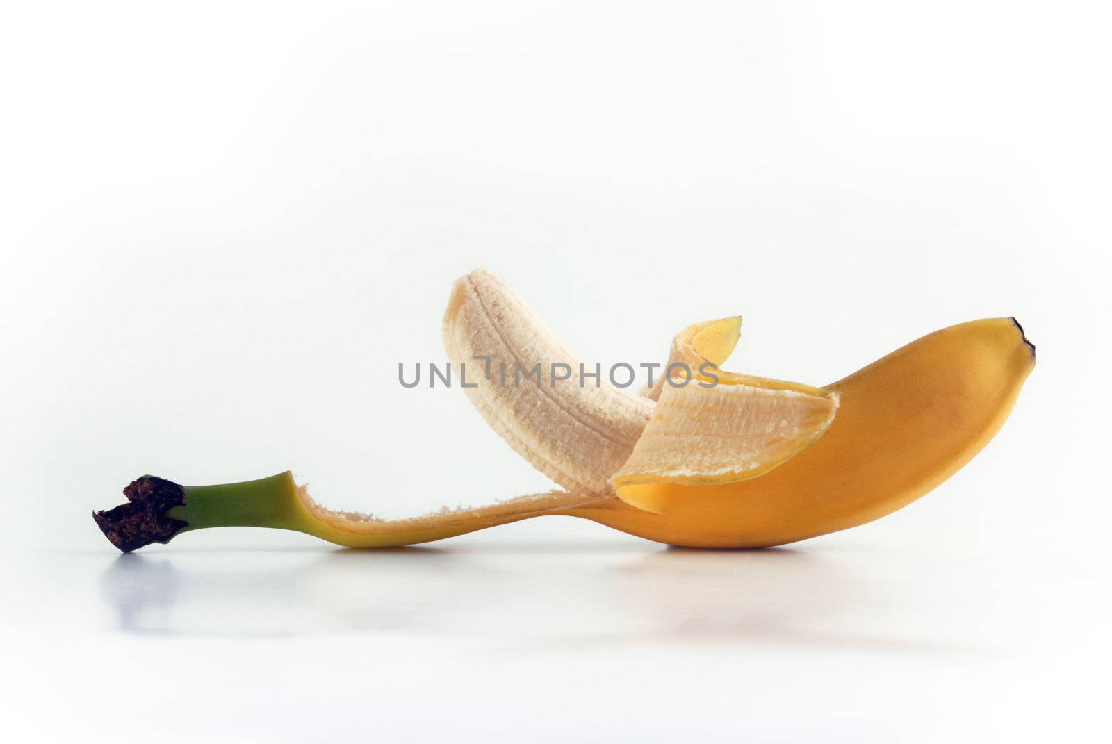 Peeled banana. Ripe fruit isolated on white background