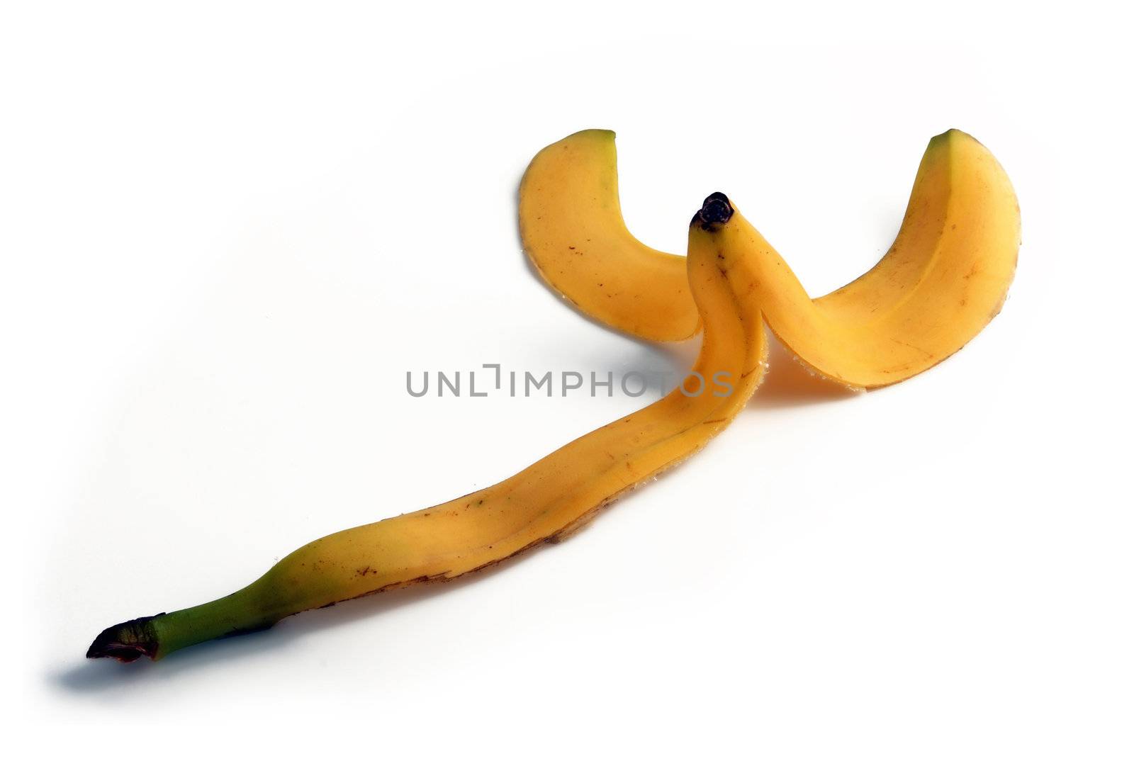 Banana peel. Fruit peel isolated on the floor. by cienpies