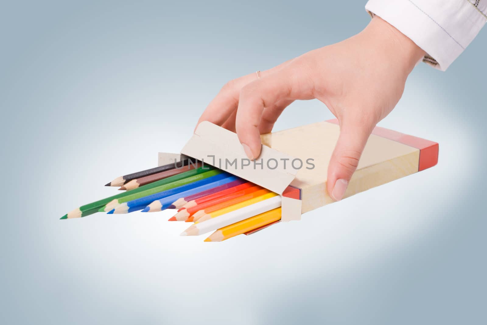 Hand with box of colored crayons. #3