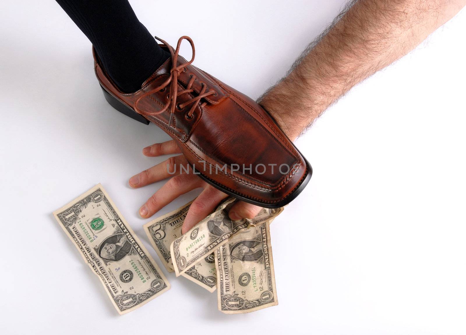 Shoe crushing a hand that holds money. White background by cienpies