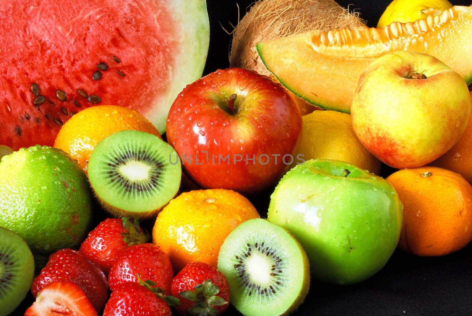 Colorful fresh fruit assortment on black background