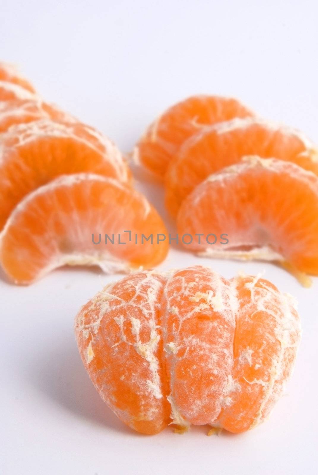 Tangerine fruit over white by cienpies