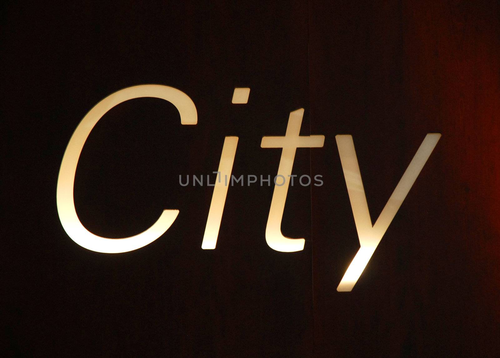 Billboard written with the word City on dark red and black tones