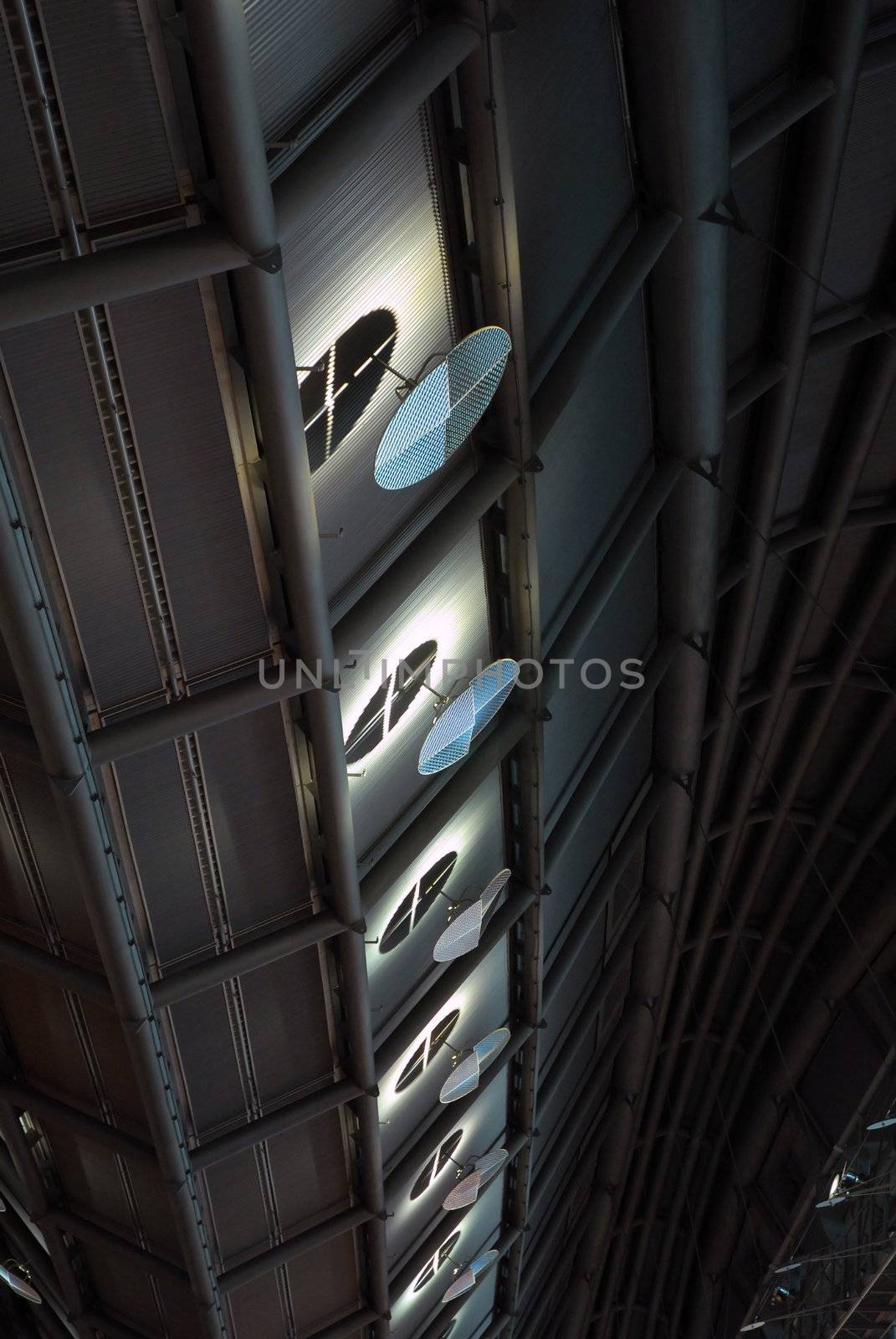 Tech roof with spot lights reflecting smooth light on metallic circles