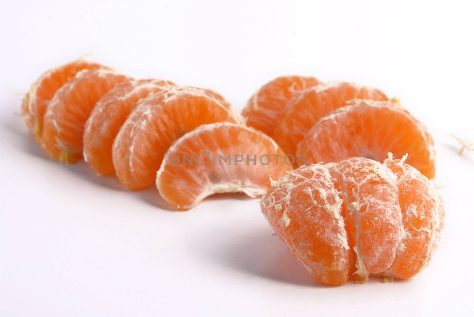 Juicy tangerine slices on white background