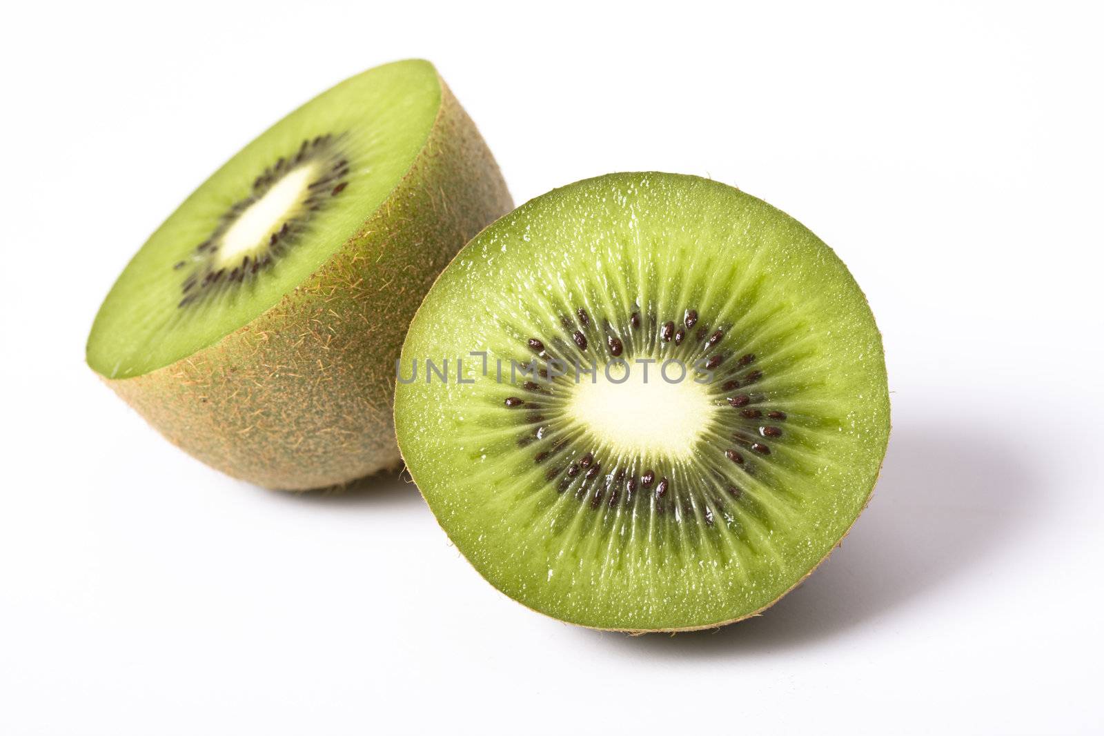 a detail of a kiwi fruit on white background by bernjuer