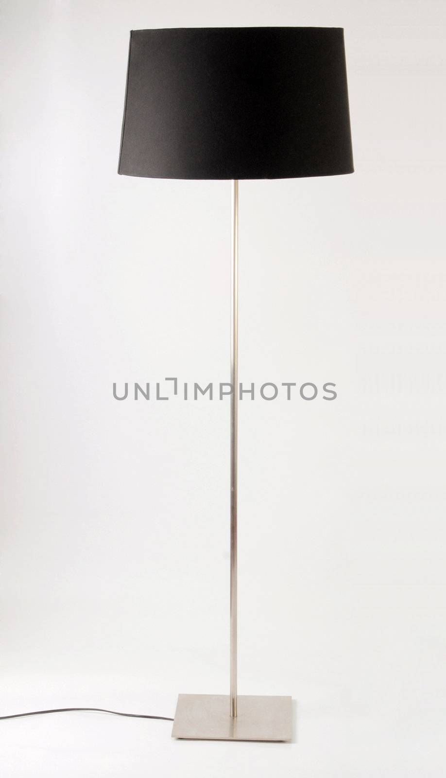 Contemporary floor lamp. Isolated on white  by cienpies