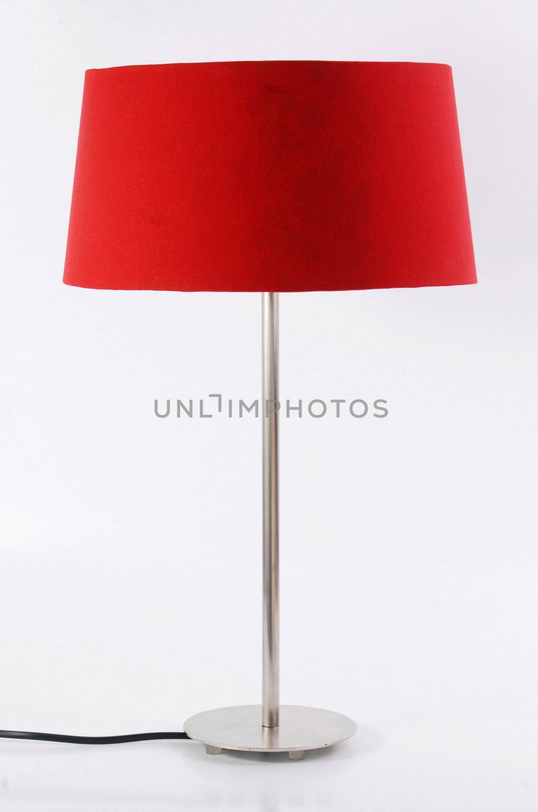 Contemporary metallic and red floor lamp isolated on white background