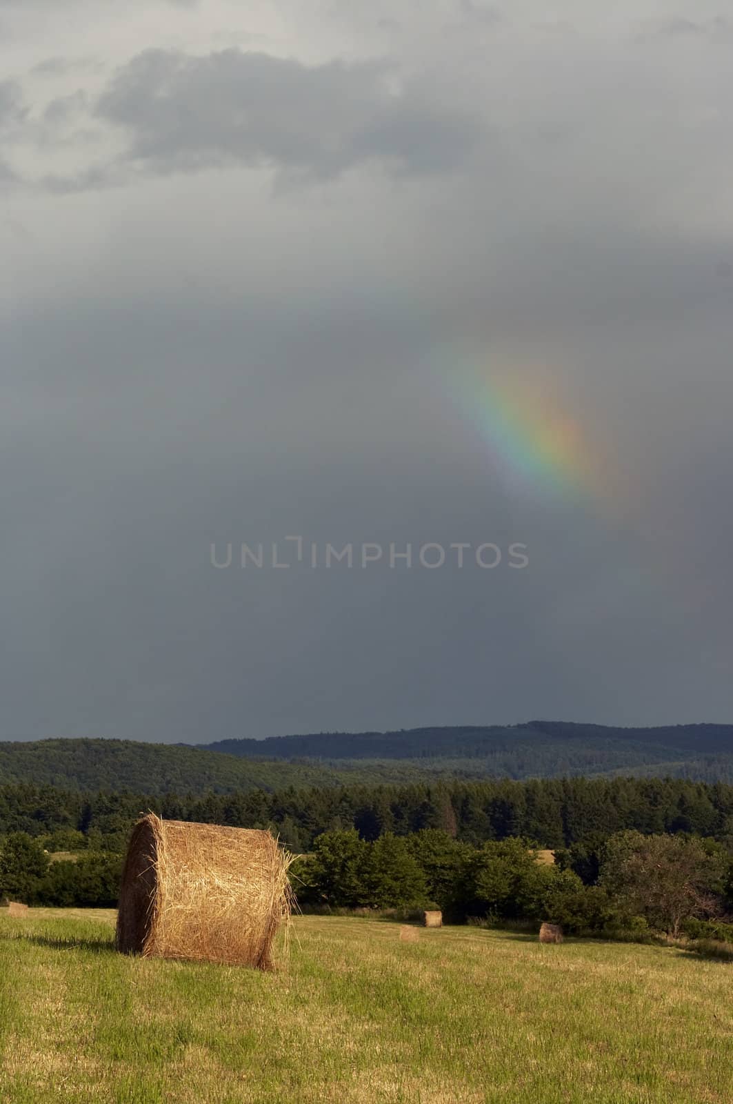 overcast sky with rainbow by Mibuch