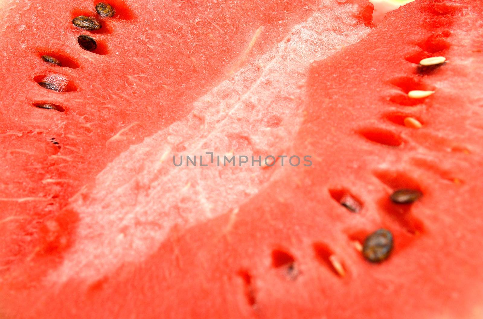 Red juicy ripe water-melon. A background