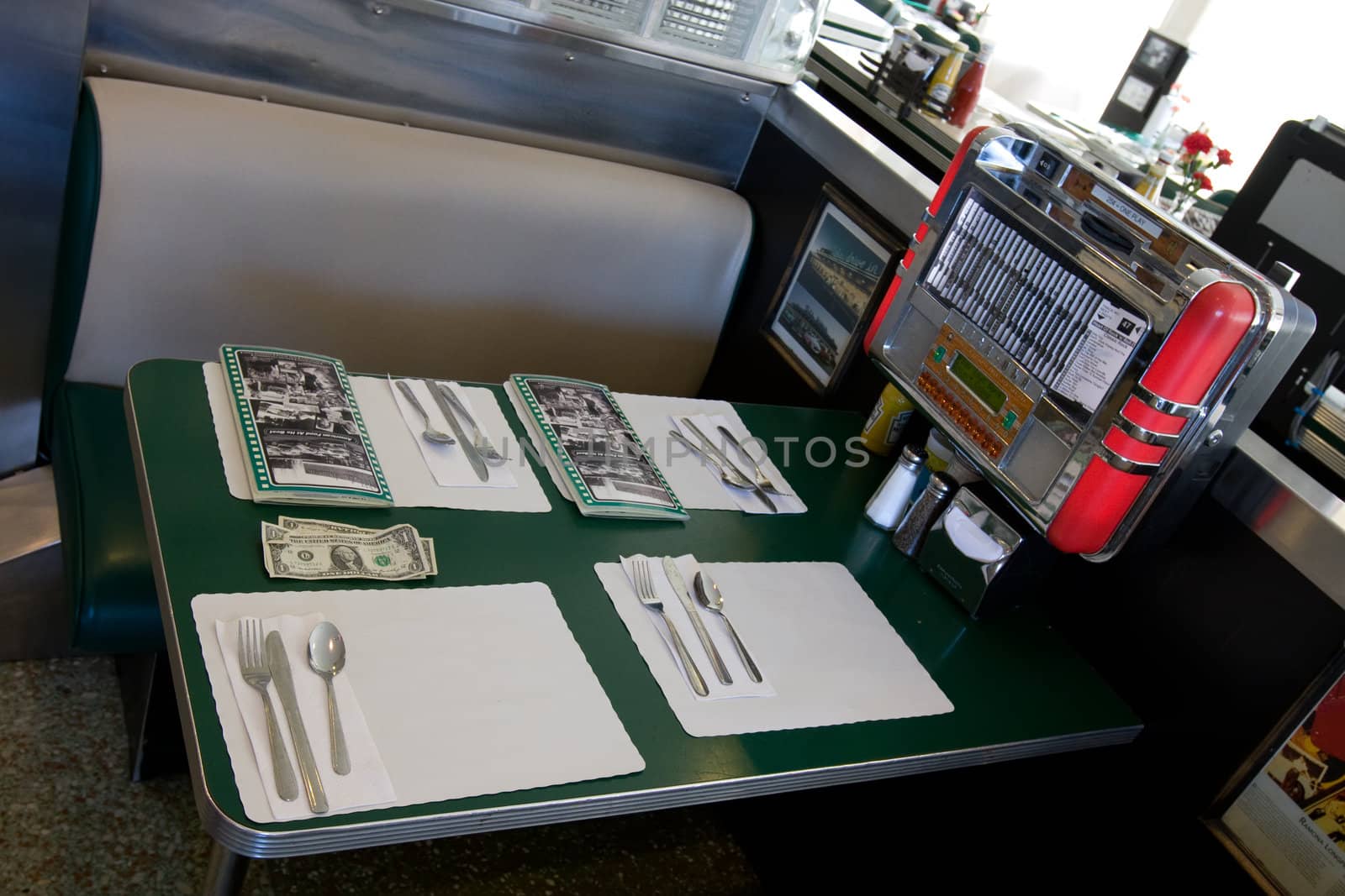 Typical american restaurant with empty table and menu on it 