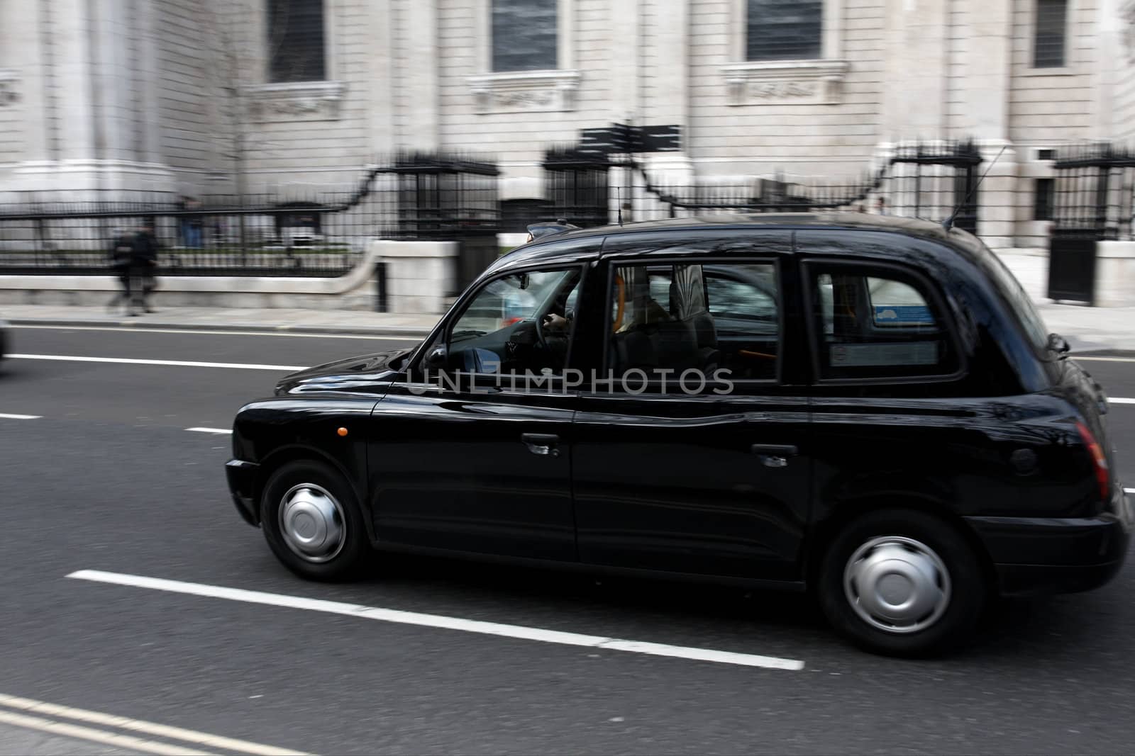 Black London Taxi moving fast