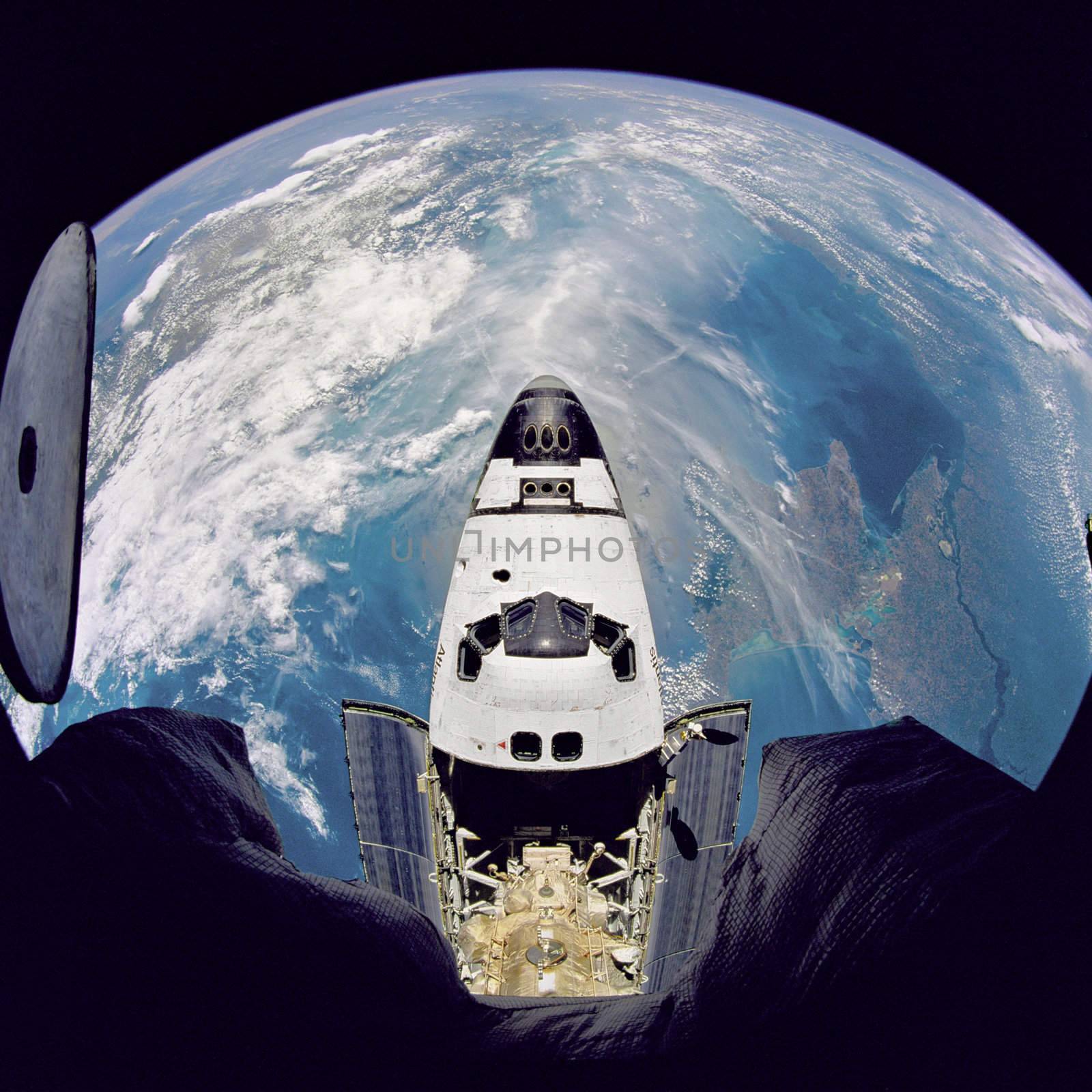 Fish-eye view of the Space Shuttle Atlantis as seen from the Russian Mir space station during the STS-71 mission. ** Credit: NASA / yaymicro.com **