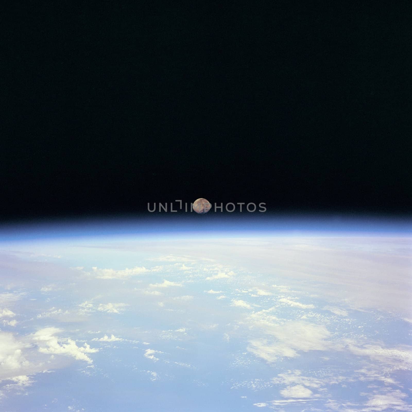 Moon set over the Earth limb taken from Space Shuttle Discovery during STS-70 mission. ** Credit: NASA / yaymicro.com **