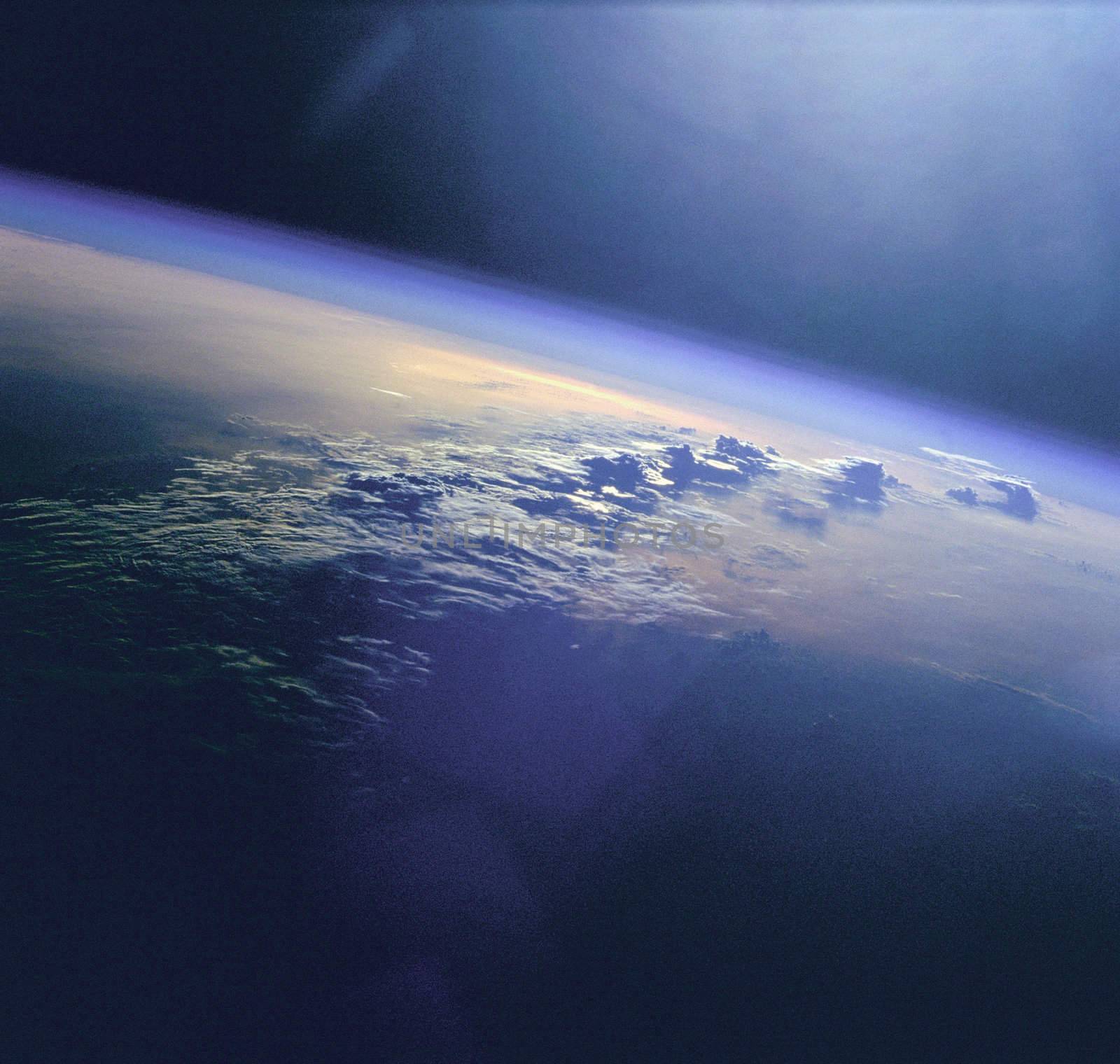 Clouds and sunglint as seen during the STS-96 mission from the Space Shuttle Discovery. ** Credit: NASA / yaymicro.com **