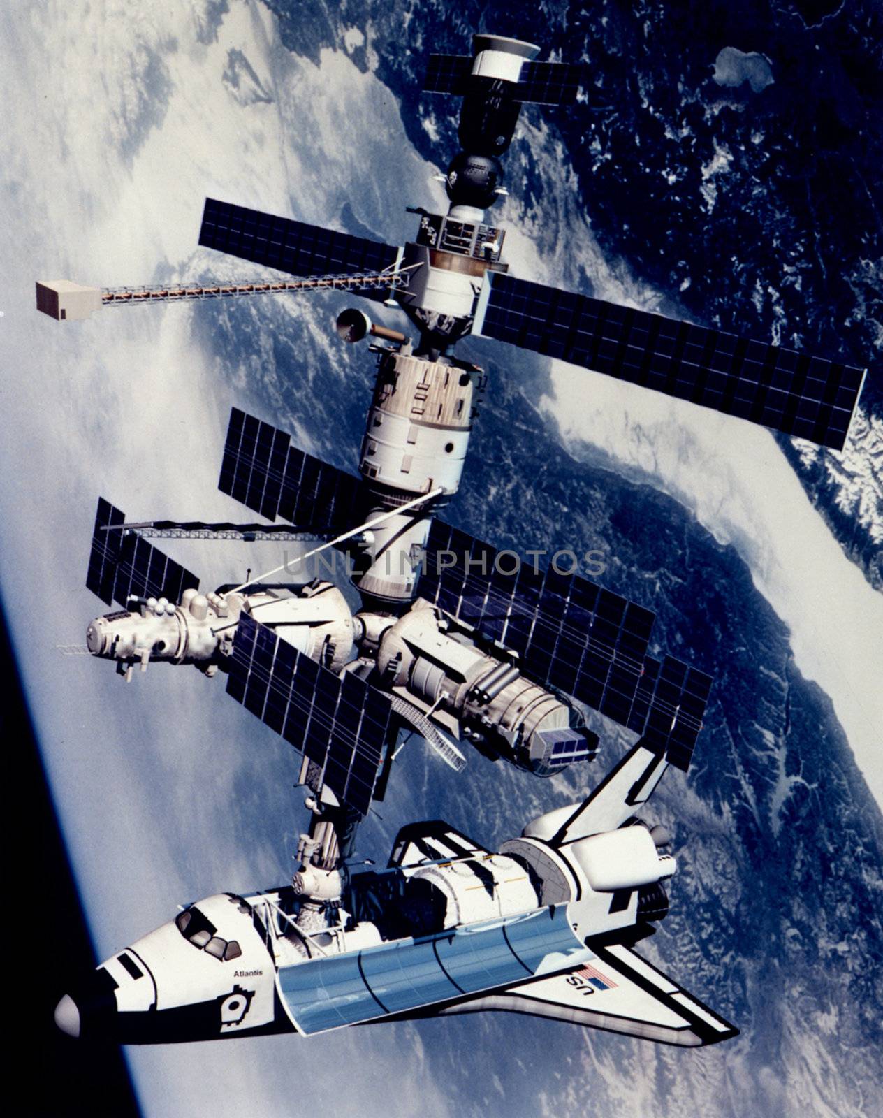 Shown is a technical rendition of the Space Shuttle Atlantis docked to the Kristall module of the Russian Mir Space Station. The configuration shown is that of STS-71/Mir Expedition 18, a joint U.S. Russian mission completed in June 1995. The Space Shuttle/Mir combination, which was the largest space platform ever assembled, is shown overflying the Lake Baikal region of Russia. The Space Shuttle Atlantis appears in a new configuration for the STS-71 flight. ** Credit: NASA / yaymicro.com **