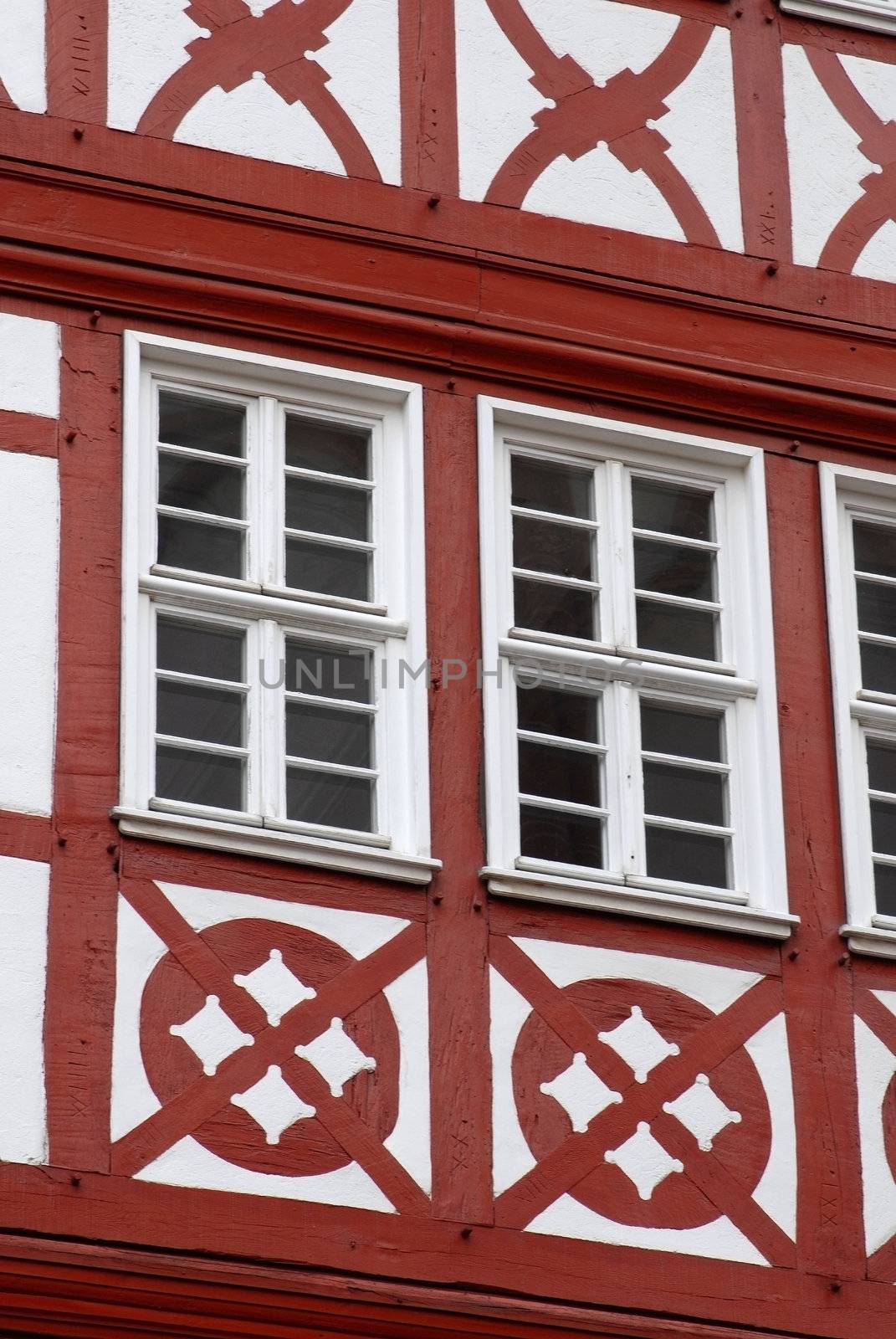 Architectural detail of white and red windows 