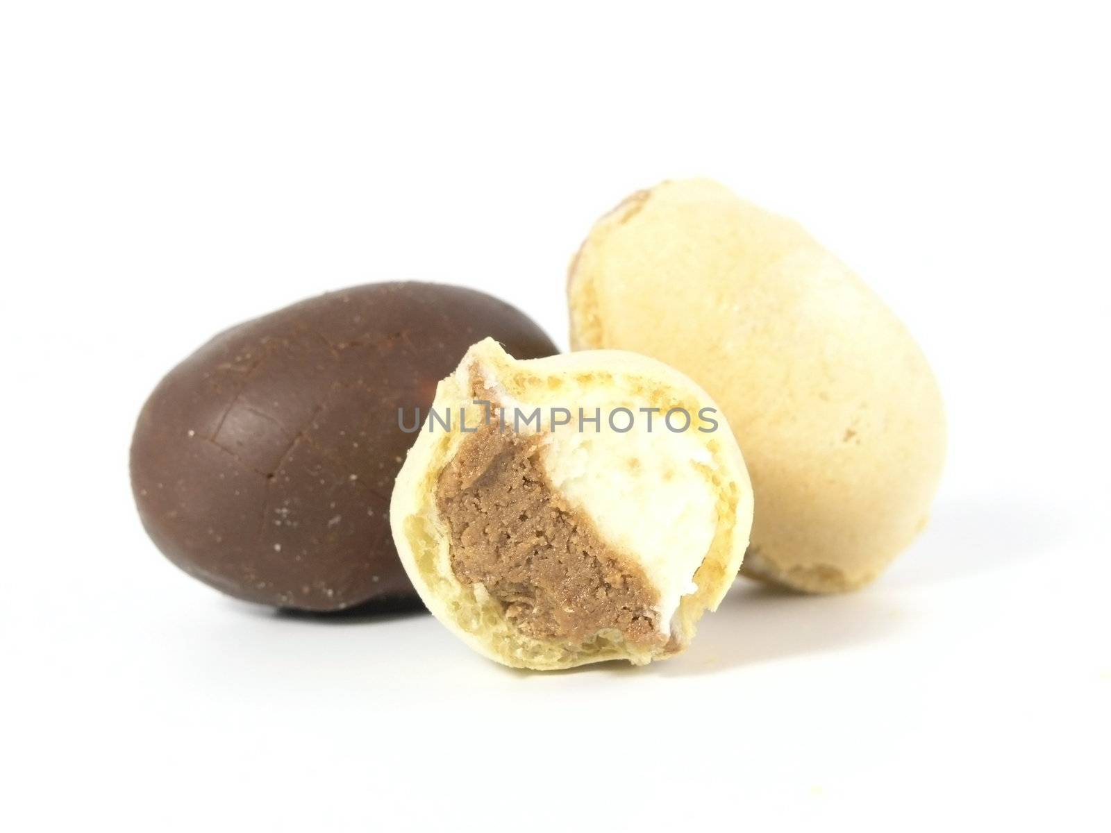 chocolate eggs and wafel eggs isolated on white background