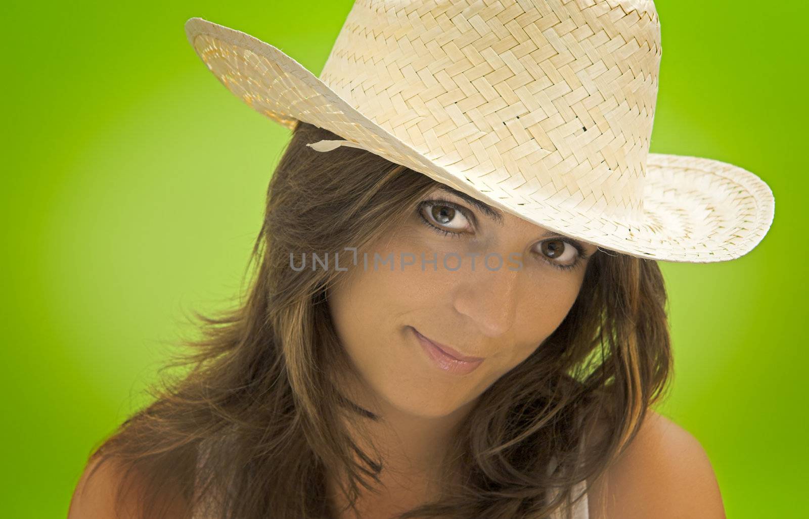 Cowgirl portrait in a green background