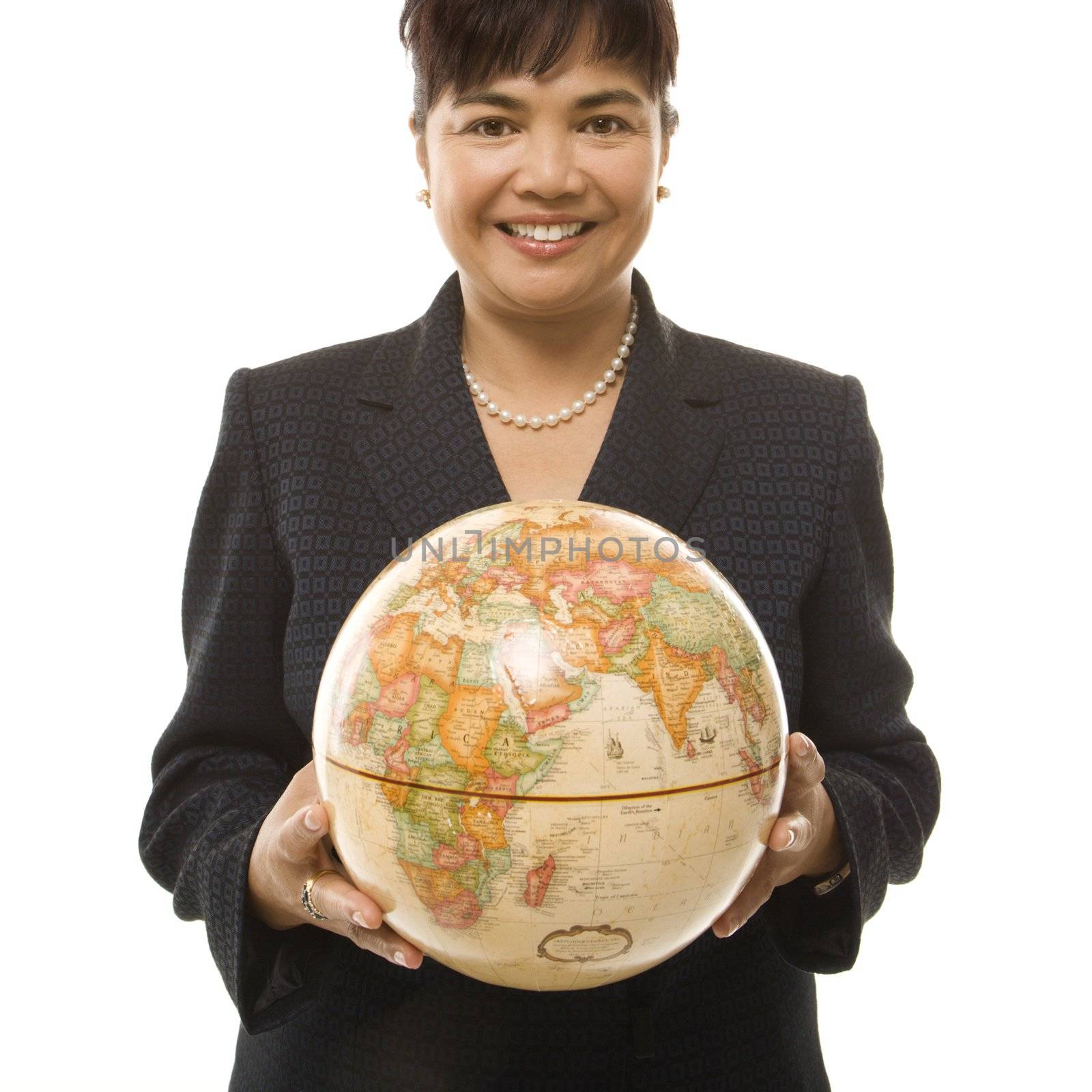 Businesswoman holding globe. by iofoto