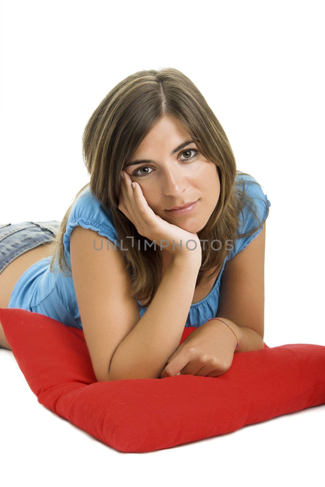 Beautiful woman with a soft cushion in a white background