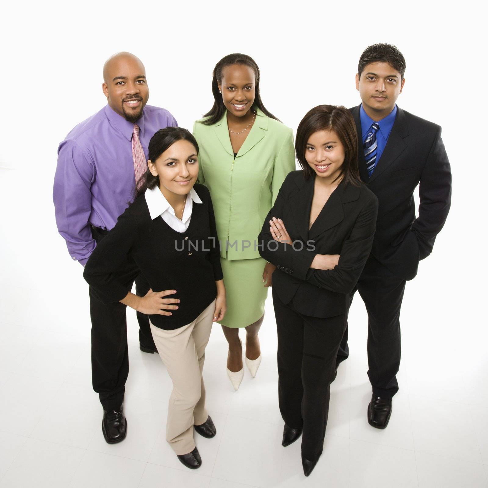 Portrait of multi-ethnic business group standing looking at viewer.