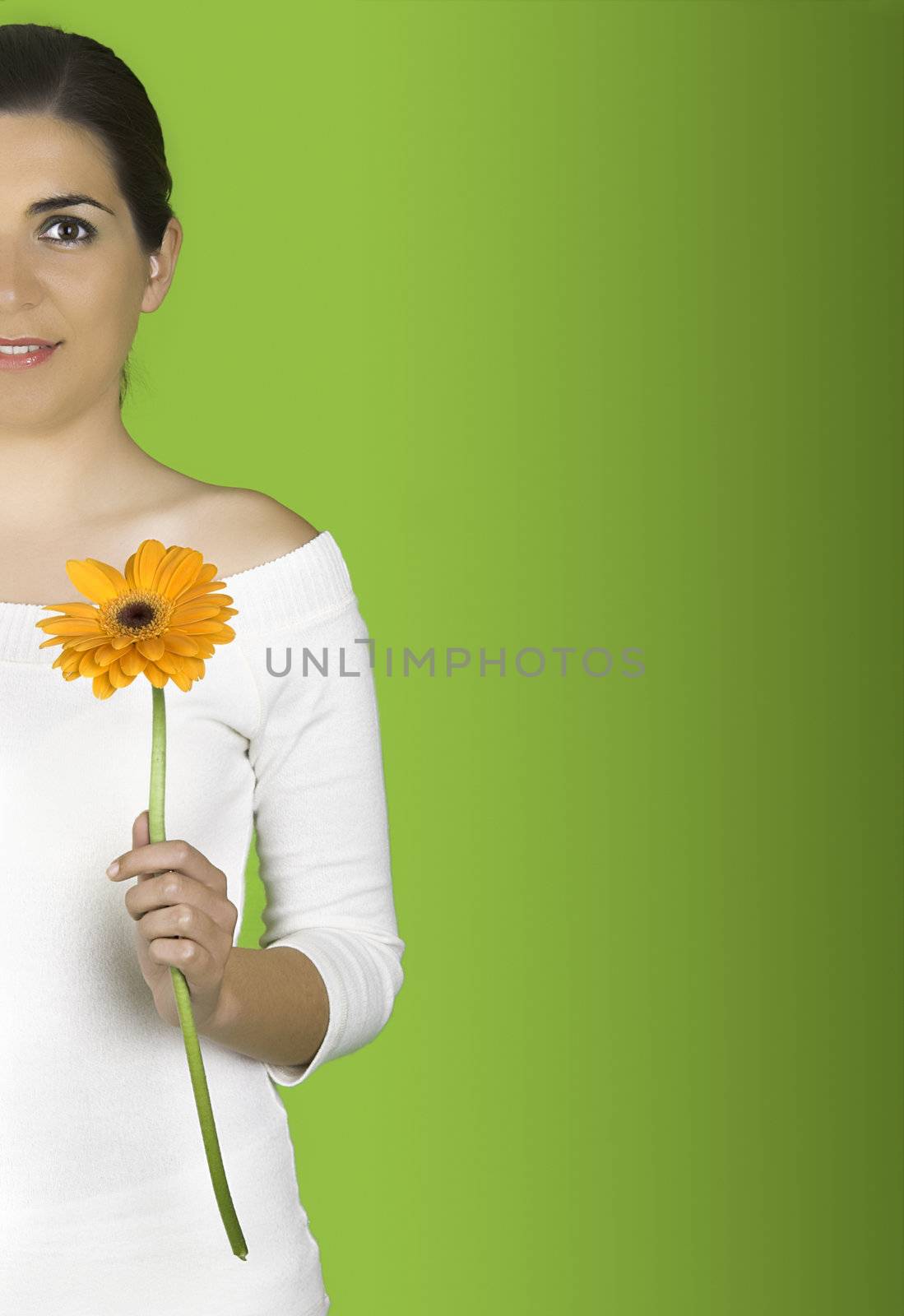 Beautiful woman with flowers on a green background