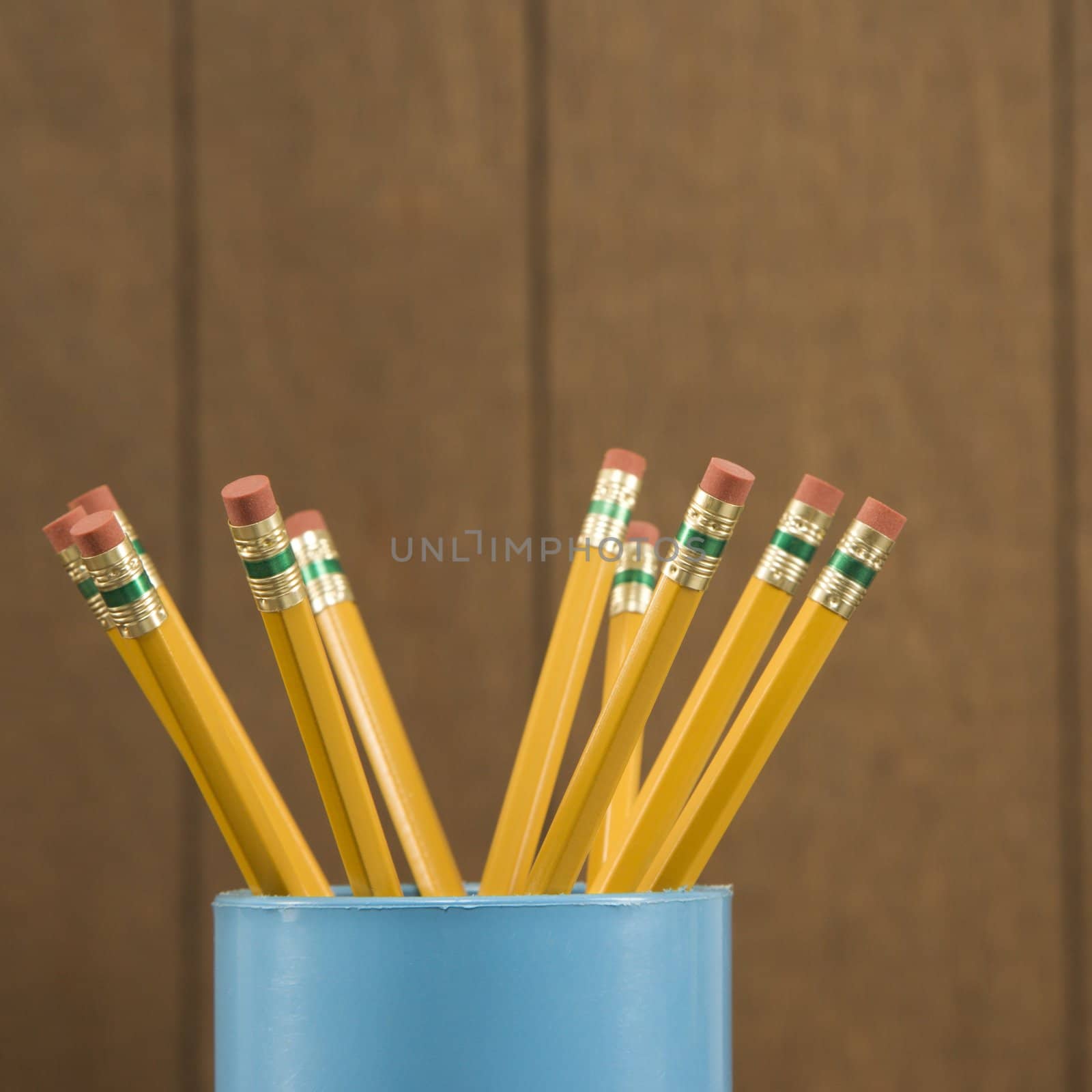 Close-up of a cup filled with wooden pencils.