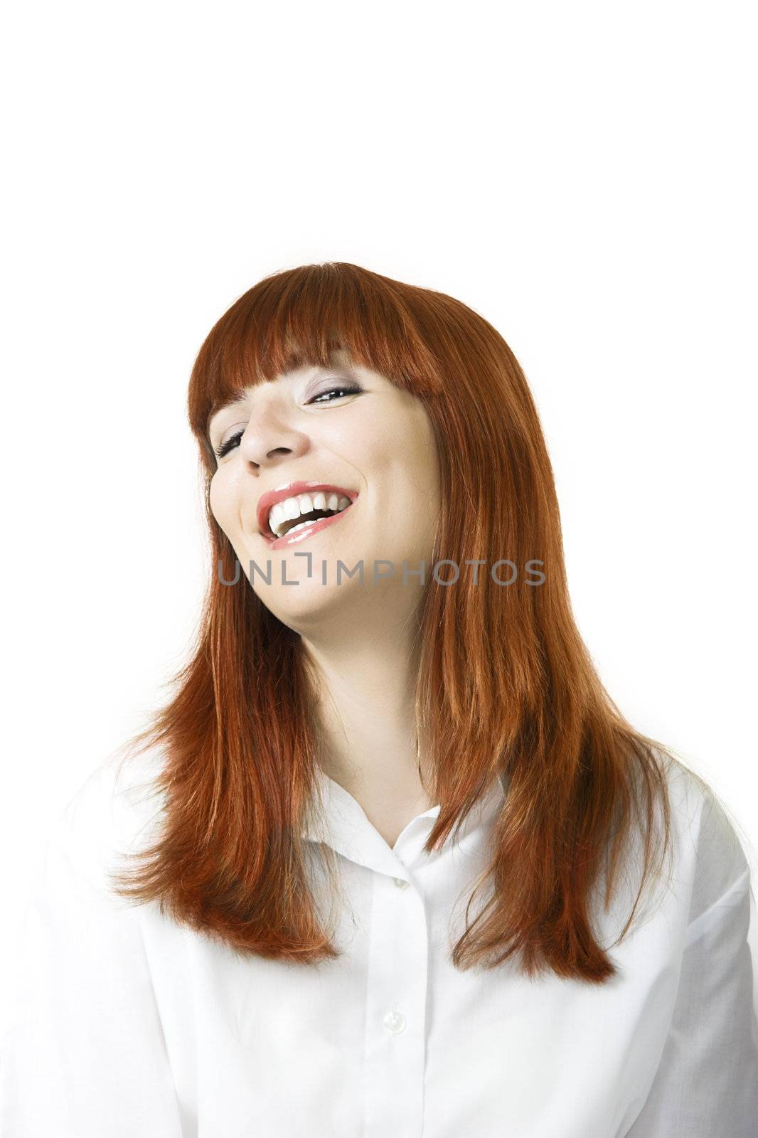 Portrait of a young beautiful woman with red hair laughing 