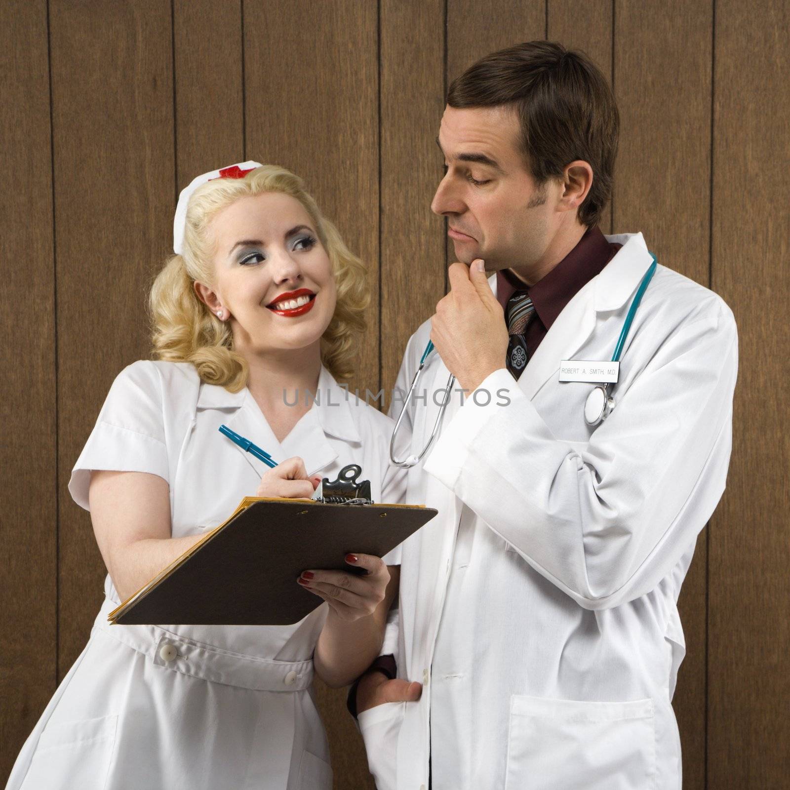 Retro nurse and doctor. by iofoto