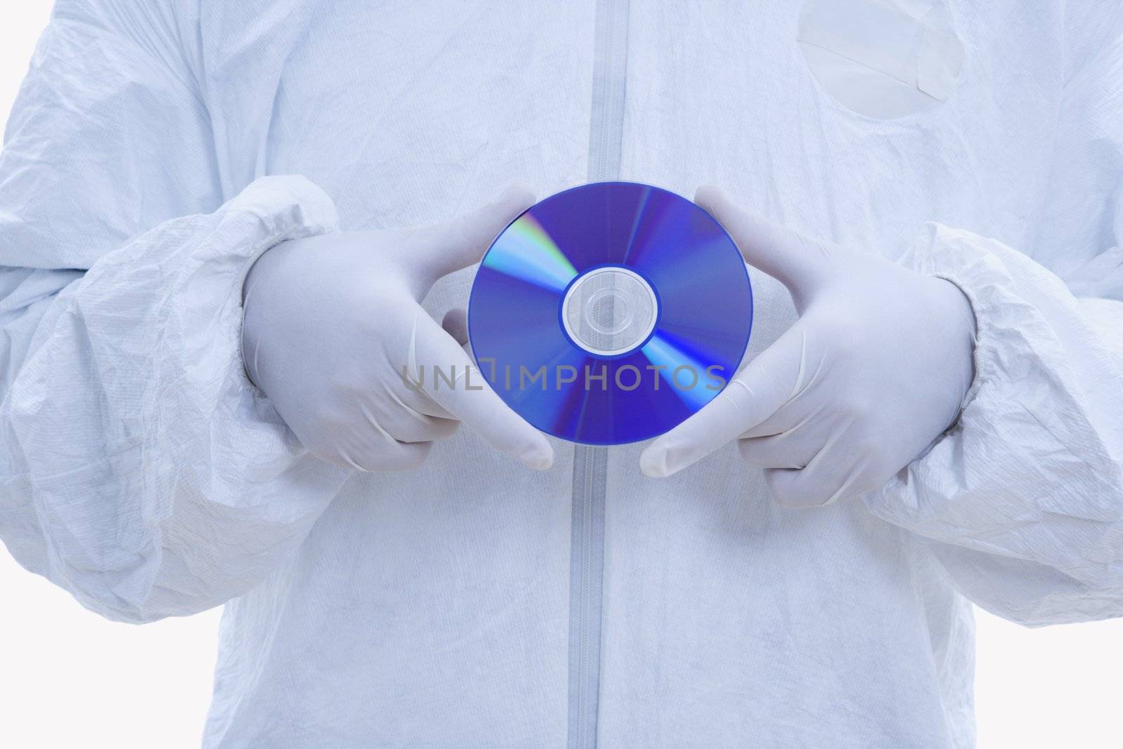 Close-up of man in biohazard suit and latex gloves holding compact disc.