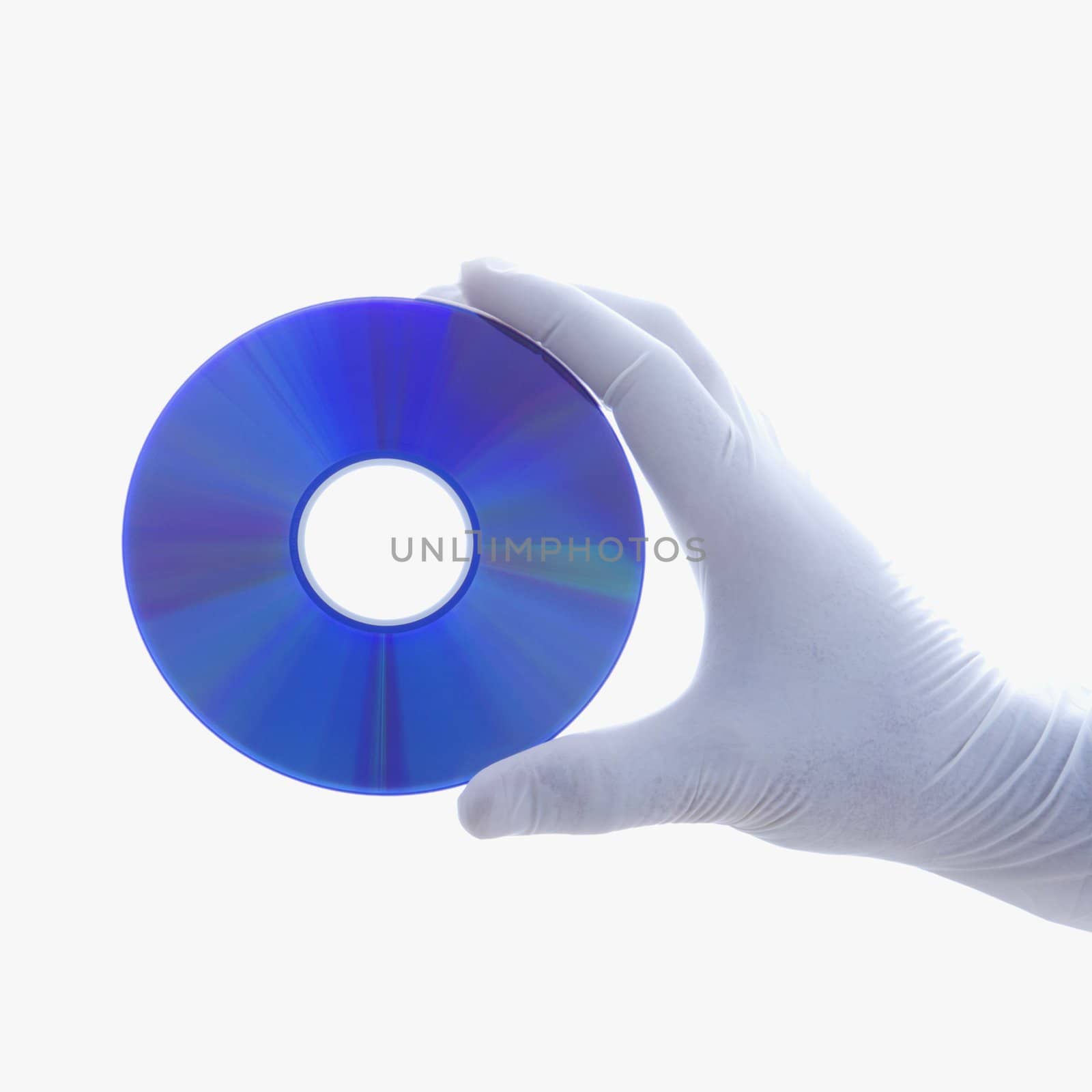 Hand in latex glove holding compact disc against white background.