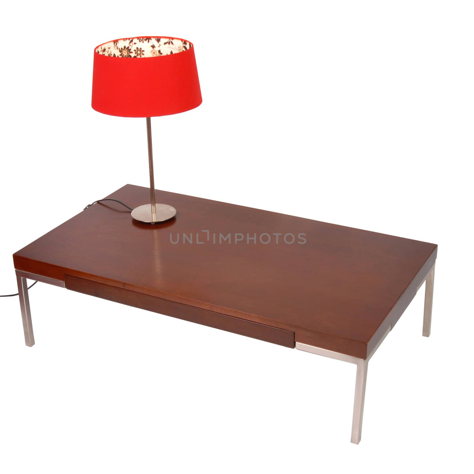 Red lamp on a wooden coffee table. Contemporary style. Isolated on white background