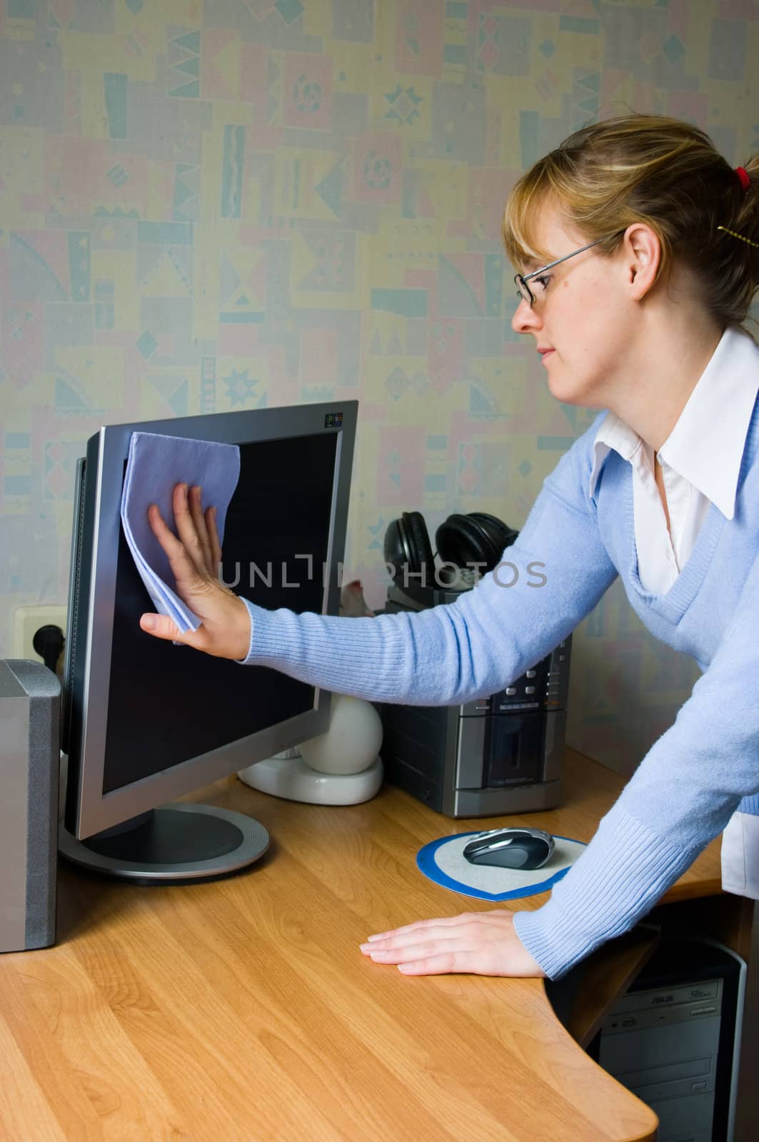 The image of the girl wiping the monitor