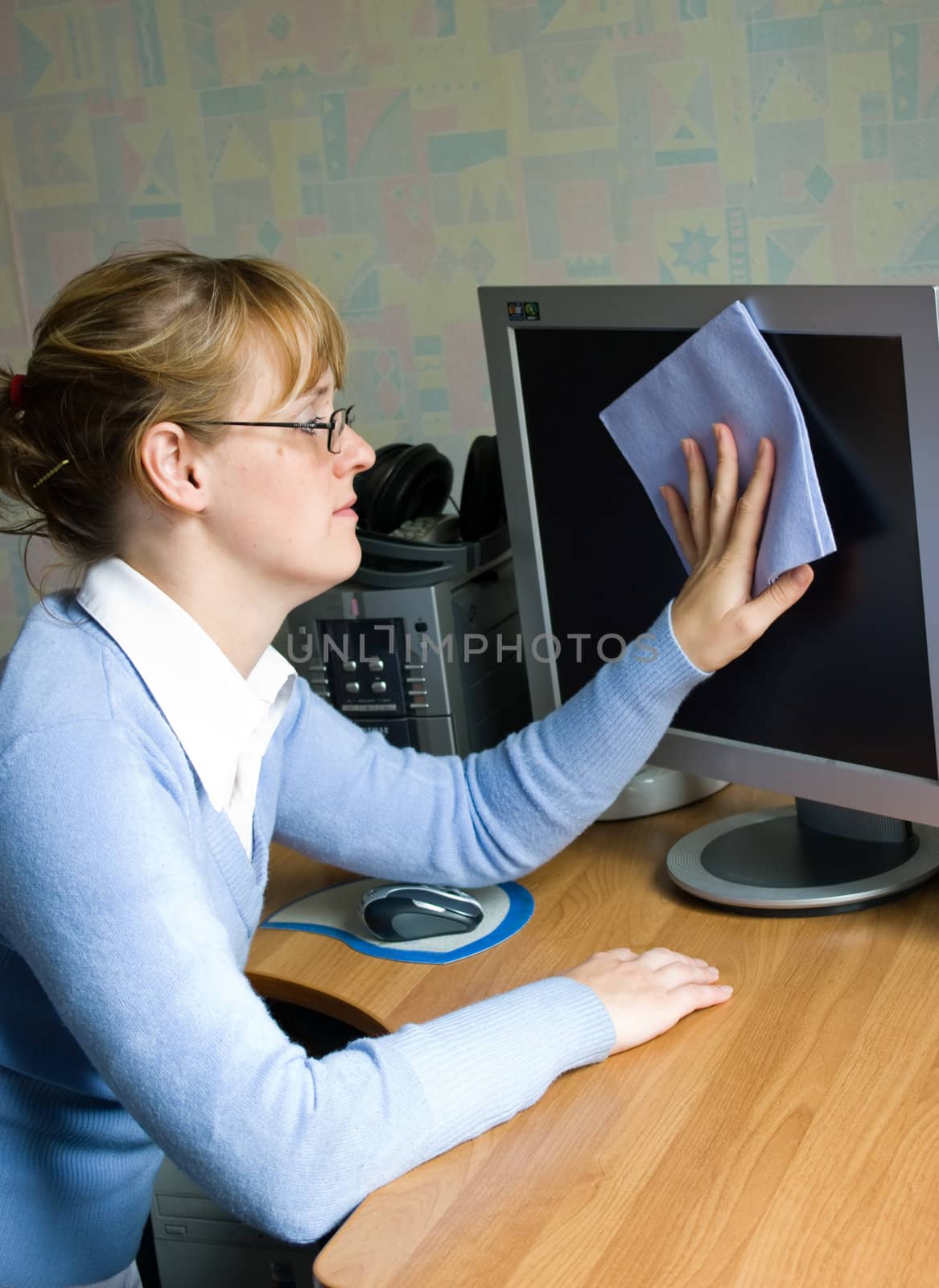 The image of the girl wiping the monitor