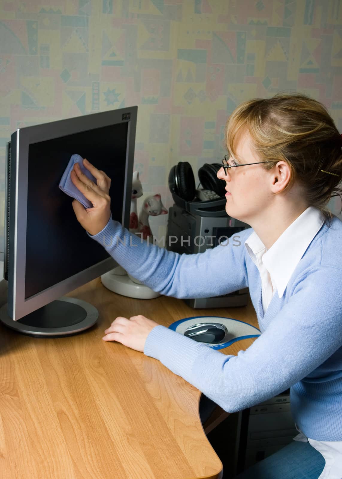 The image of the girl wiping the monitor