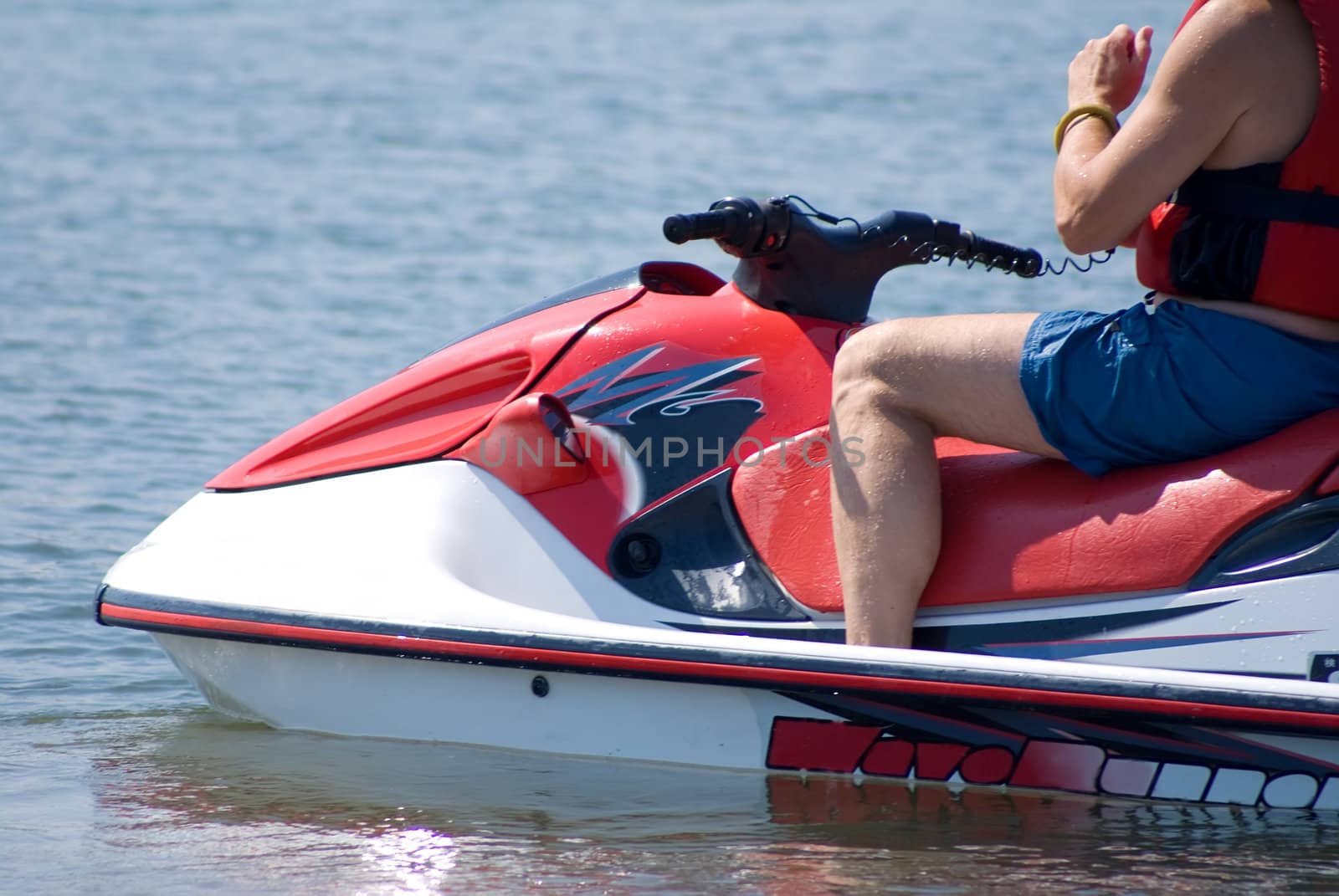 The man goes for a drive on a water motorcycle