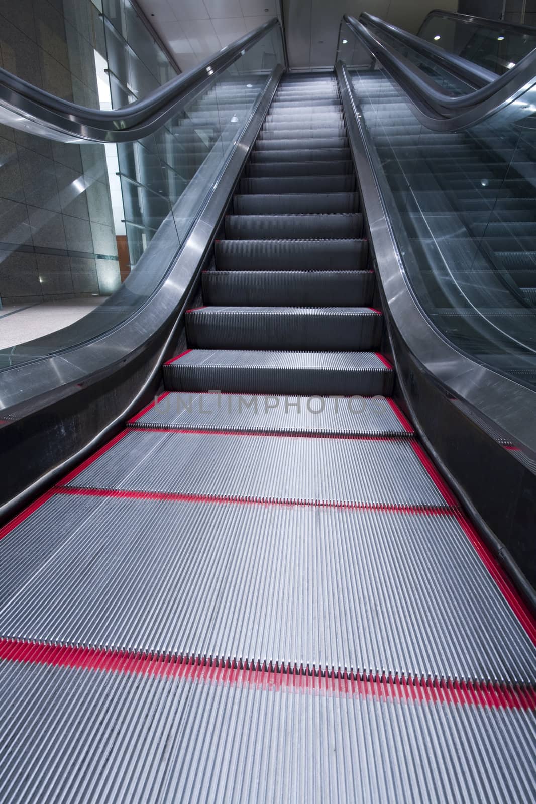 escalators in a building in hong kong at night