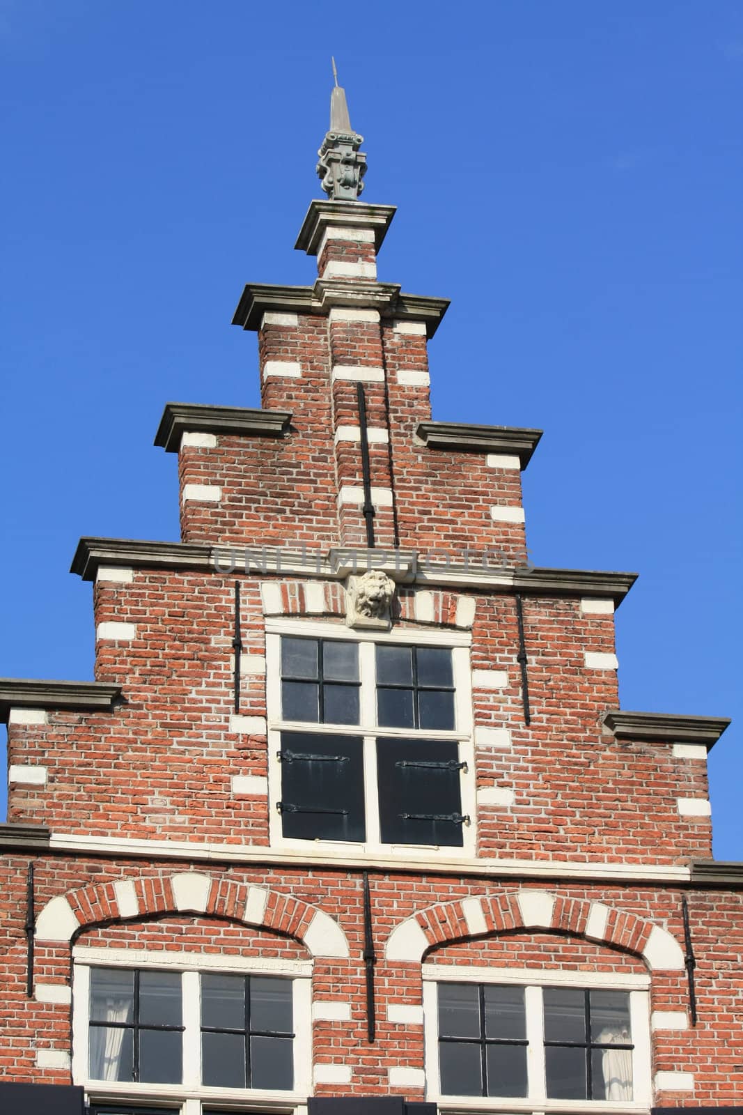 traditional dutch crow stepped gable by studioportosabbia