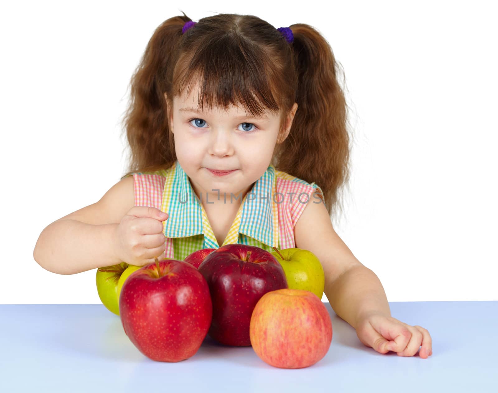 Girl playing with big ripe apples on white