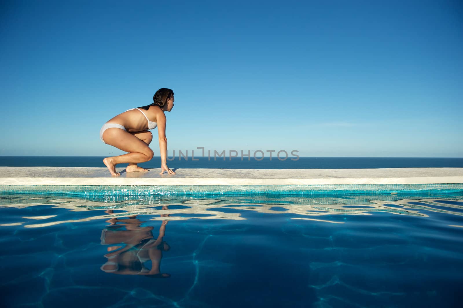 Woman relaxing in the spa swimming pool  by swimnews