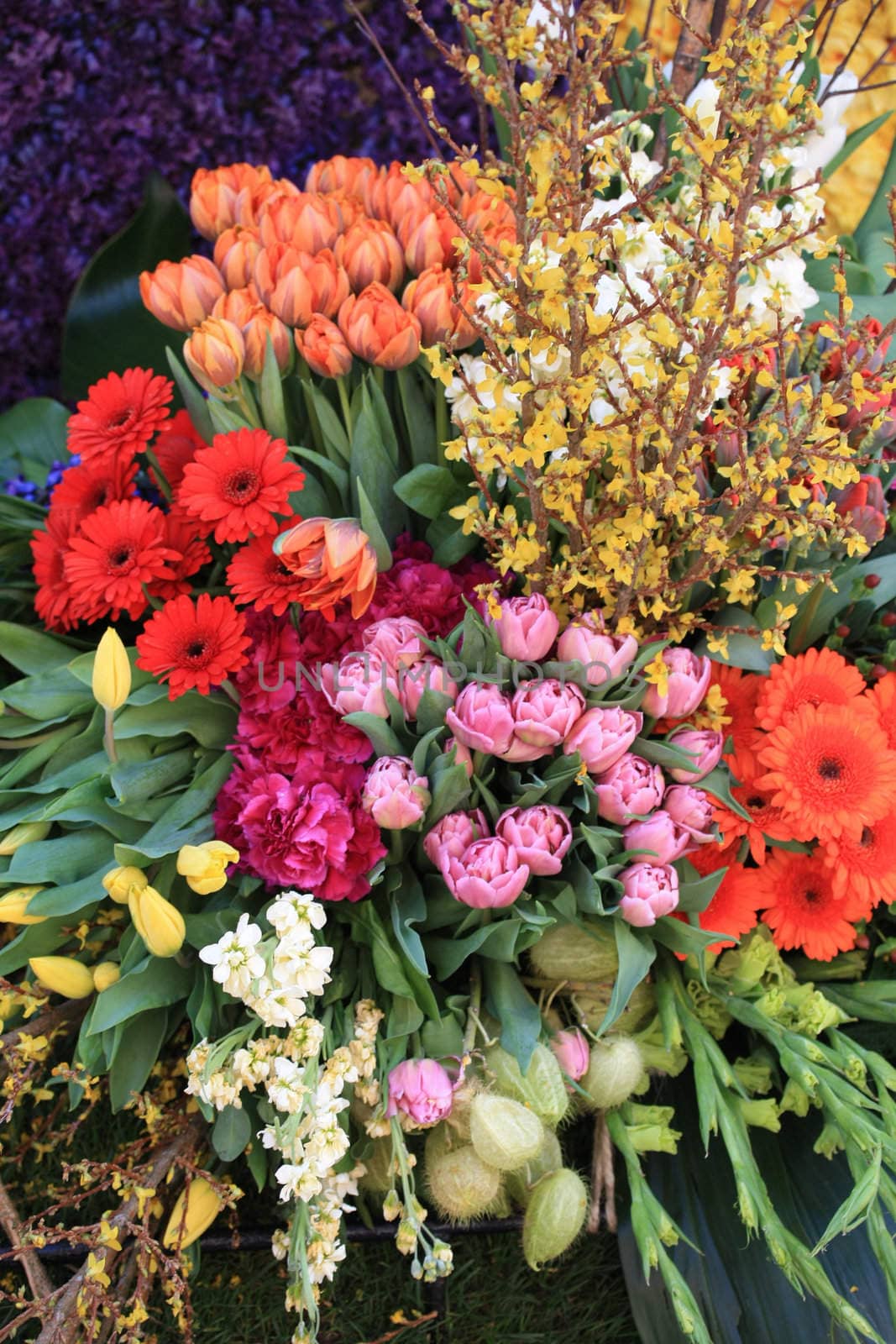 Flower arrangement in different colors by studioportosabbia