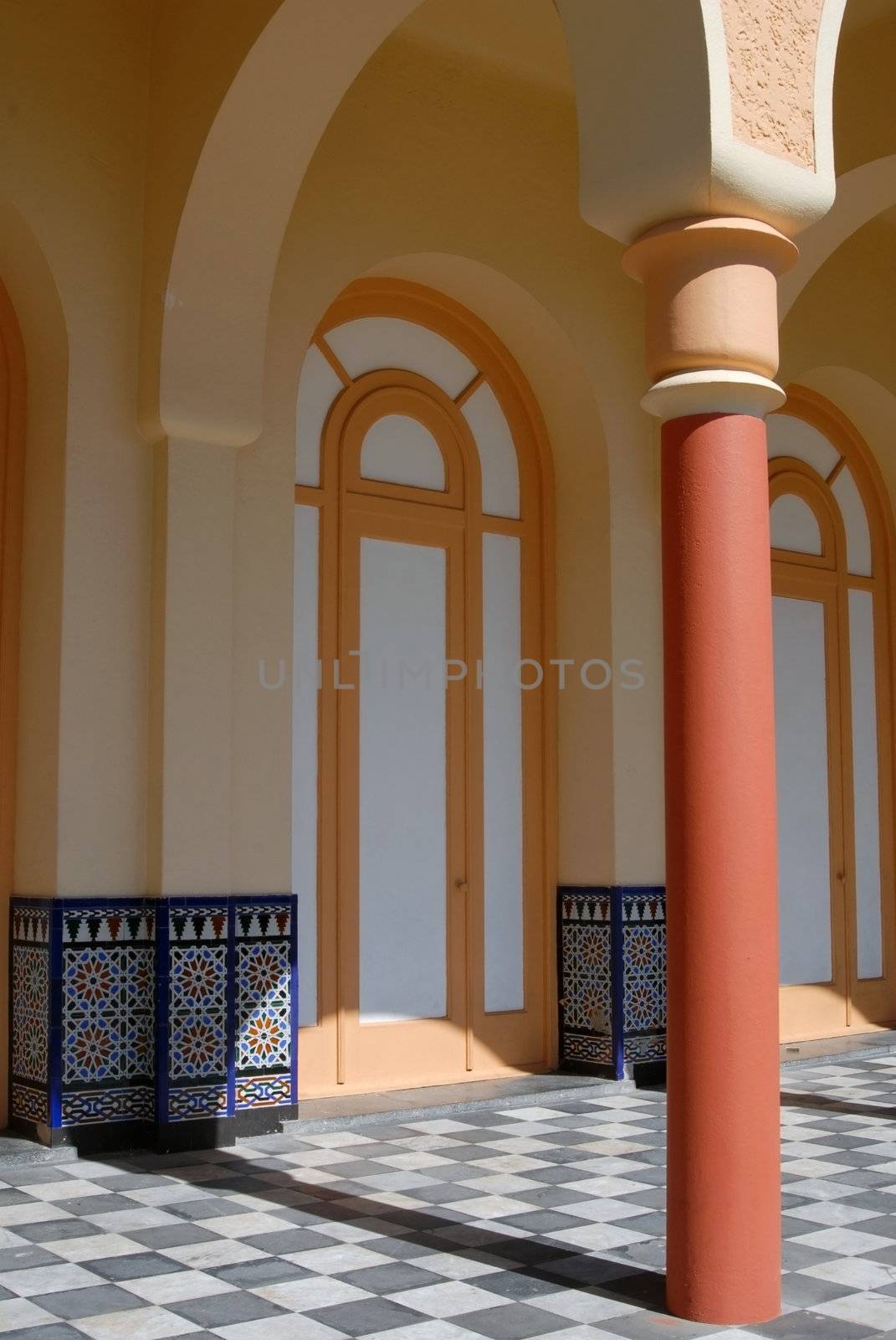 Architectural detail of an ancient building. Column and archs