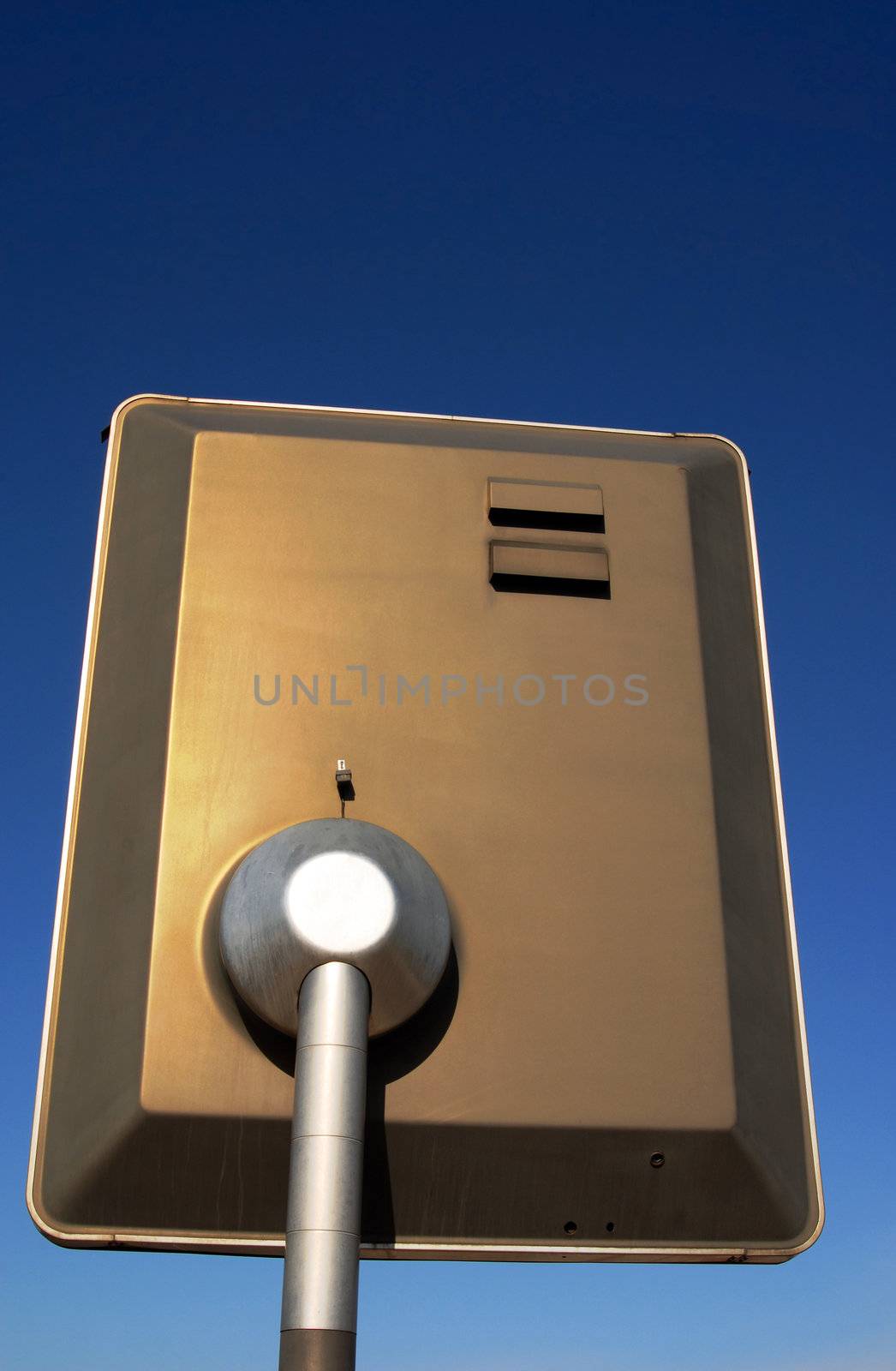 Electronic billboard seen from behind on a blue sky background