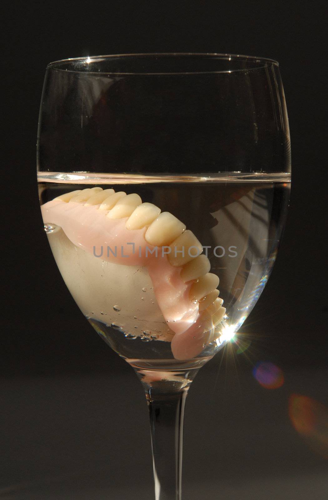 Grandfather nap. Dentures in a glass by cienpies